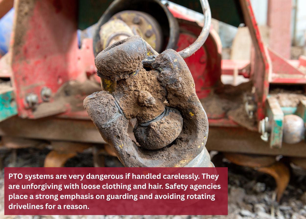 Mud-covered PTO shaft universal joint showing wear and buildup that can lead to vibration, failure, and safety risks if not repaired properly.